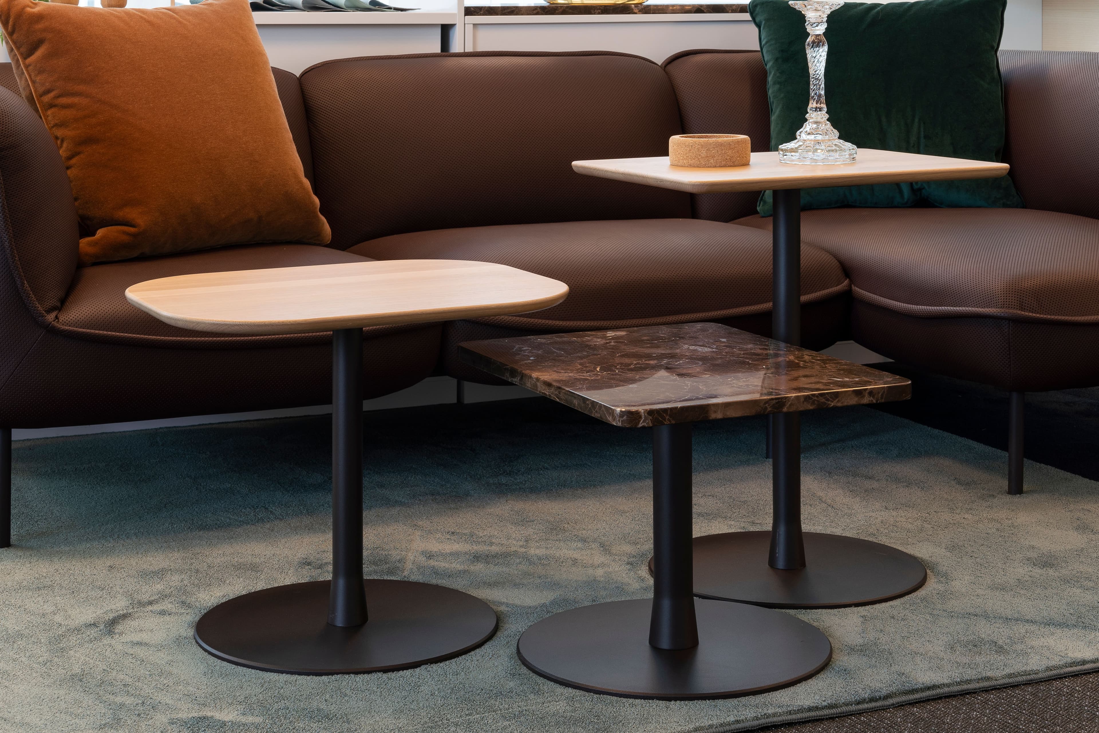 Three coffee tables with tabletops in wood and marble